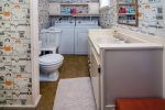 The washer and dryer are located in the downstairs bathroom. 